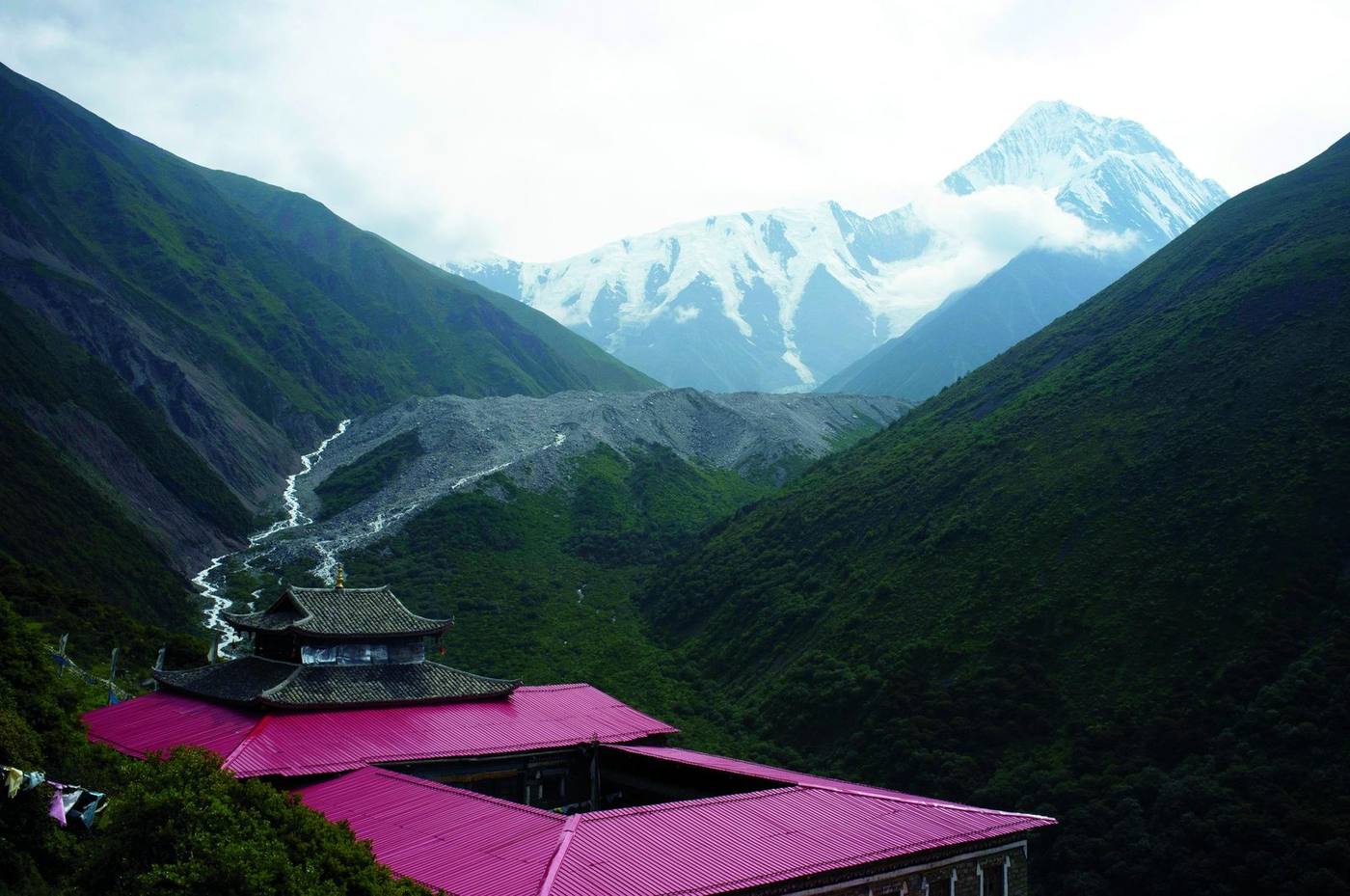 A Tibetan temple below a snow-capped peak in western China